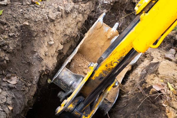 Downspout Trenching in Bryan